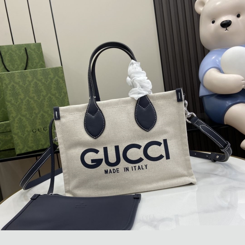 G*u*i shopping bags